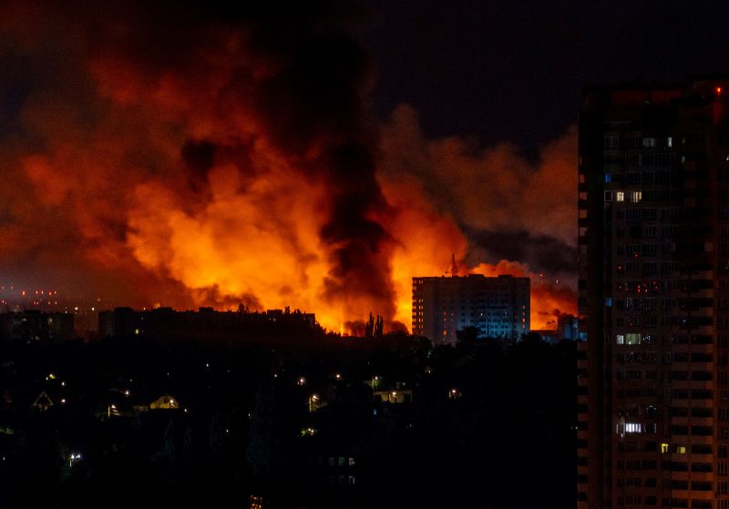 Ukraine says it struck a Russian air base as Moscow sent hundreds of drones into Kyiv